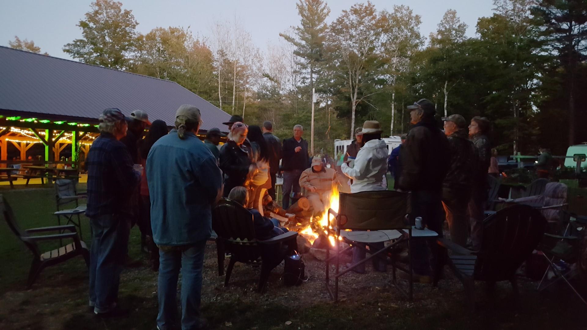 Campers gathered around the fire at Sleeping Bear